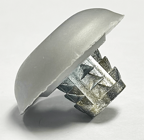 Barbed encapsulated T-nut for use with FRP trailers